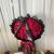 A bouquet of 50 round red rosesباقہ 50وردات احمر دائری
